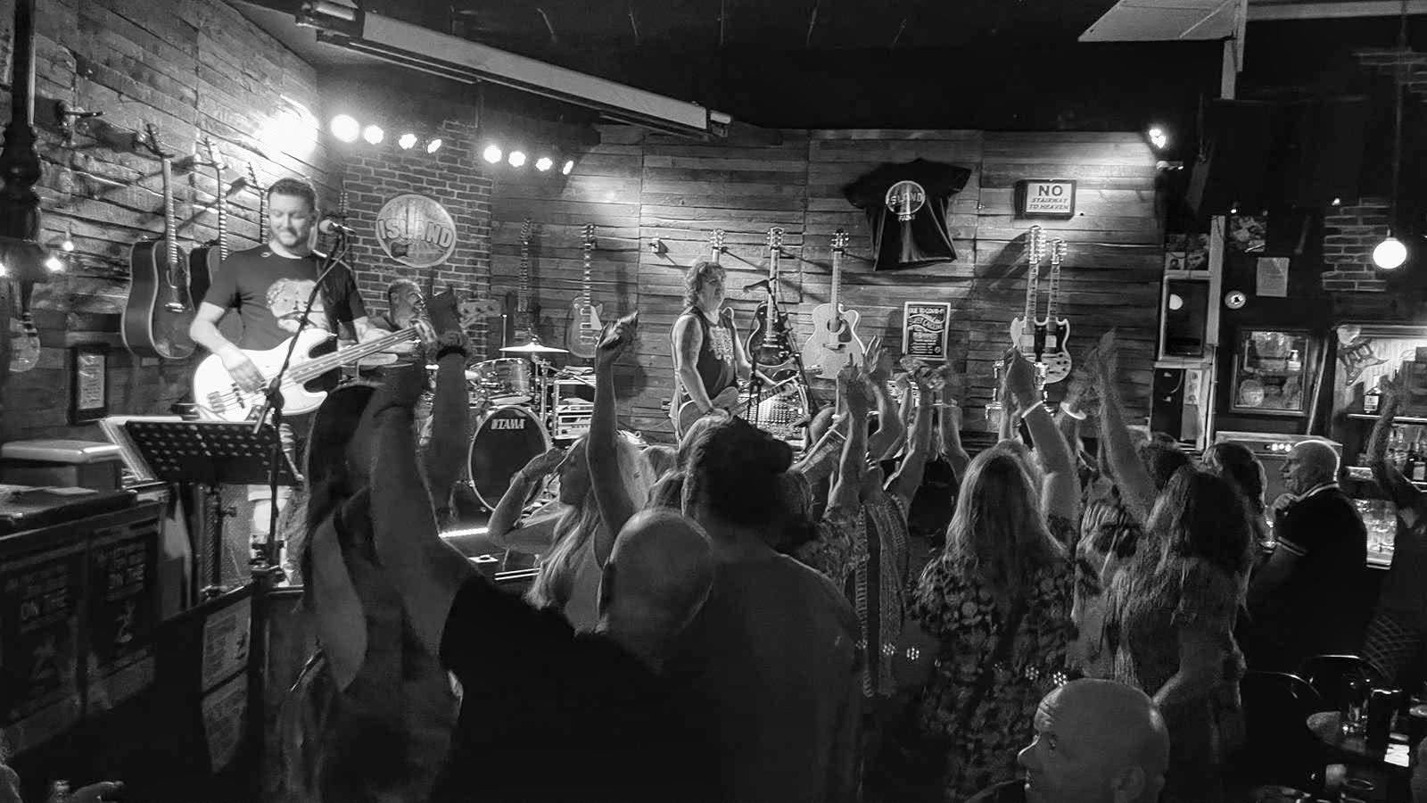 Crowd with hands up enjoying live music
