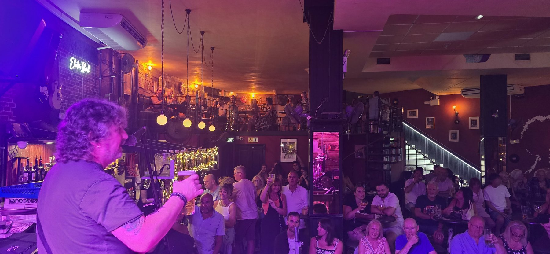 Paul raising a toast to the crowd